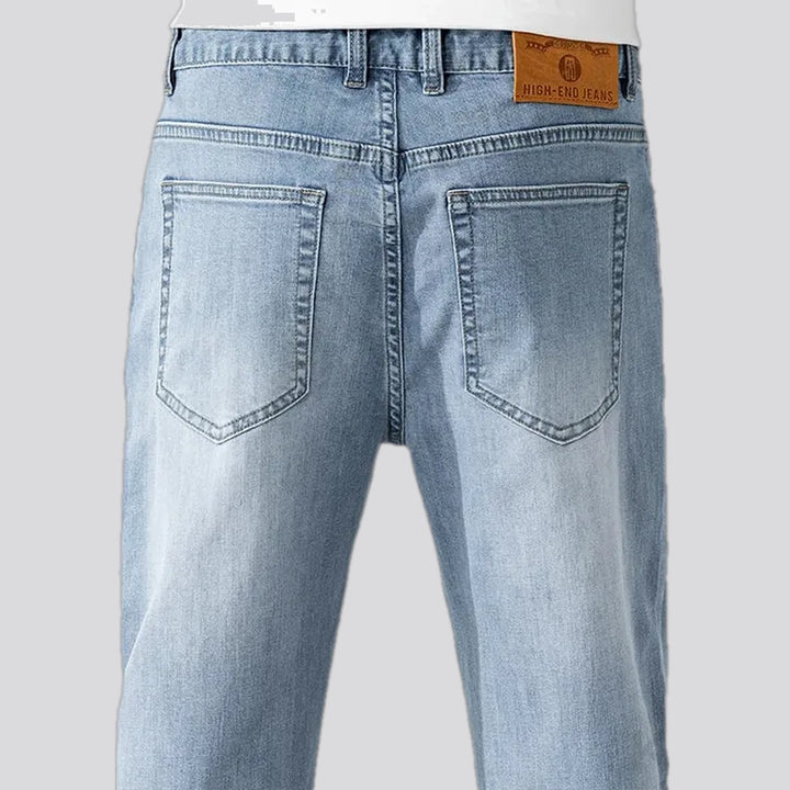 Mid rise light sanded men's jeans